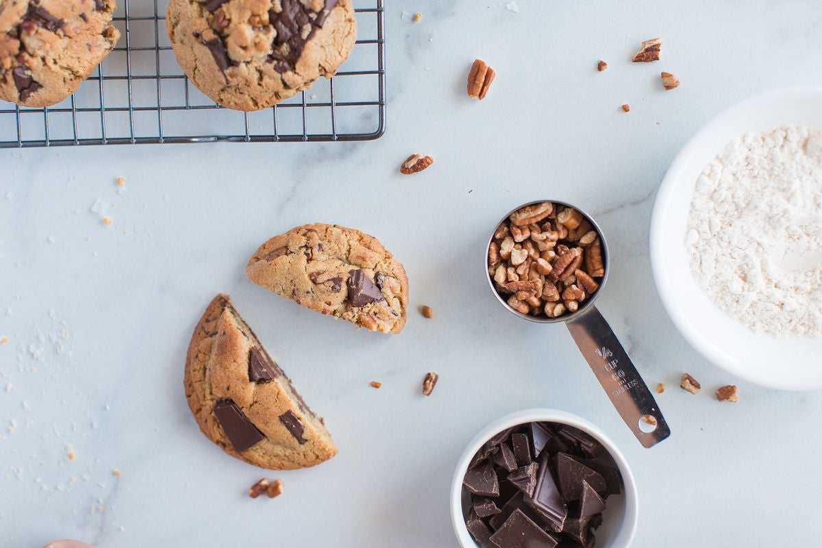 Chocolate chip pecan cookie with ingredients on display